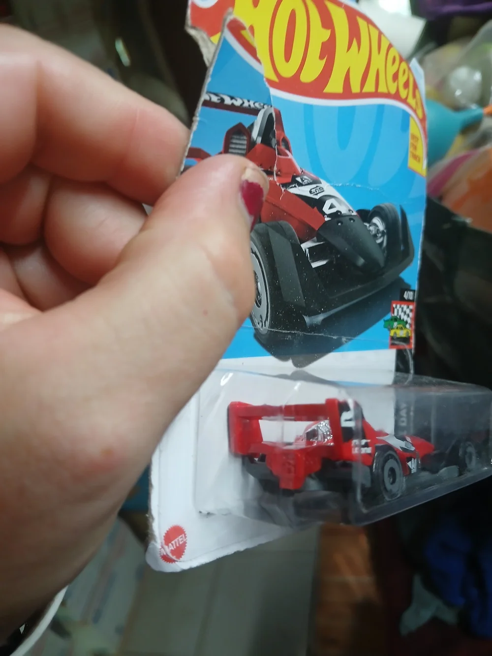 1:64 scale red and black HW-4-TRAC die-cast car from the 2024 Hot Wheels HW Race